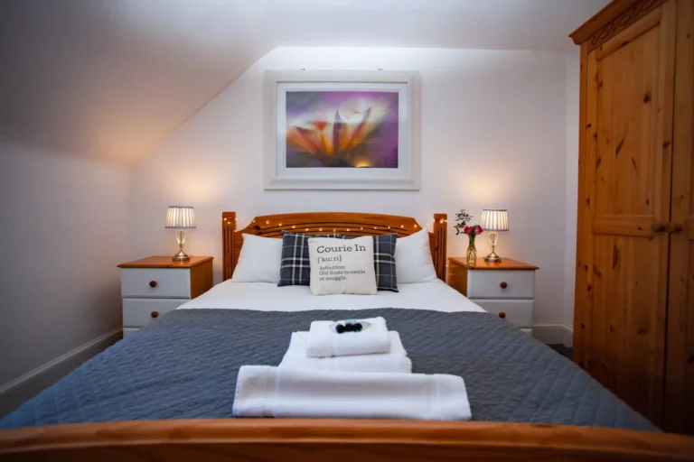 Comfortable double room interior at The Courie Inn