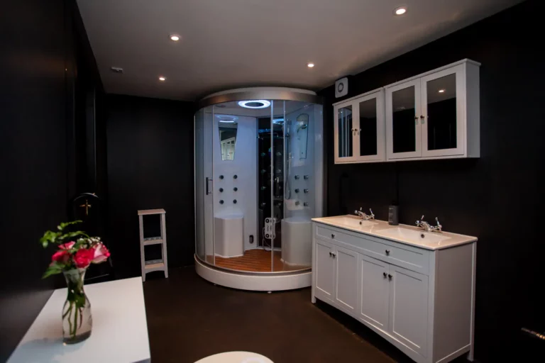 Twin room at The Courie Inn featuring two single beds and warm Highland decor